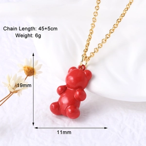Macro detail of red gummy bear pendant with 45+5cm gold chain and dimensions