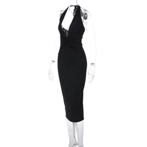 Detail of a black halter neck backless dress with a deep V-neckline in a slim fit
