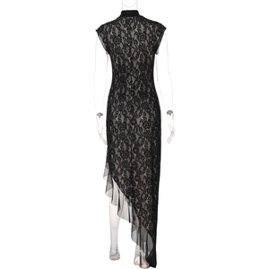 Detail view of the elegant black lace floral pattern and sheer mesh fabric on dress
