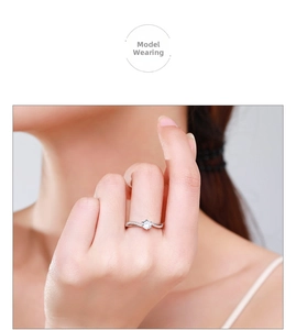 Close-up of S925 sterling silver ring with twisted band and sparkling diamond inlay