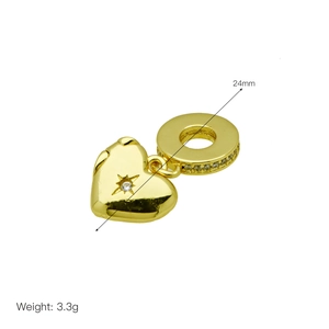 Detailed view of golden heart pendant with zircons showing 24mm size and 3.3g weight
