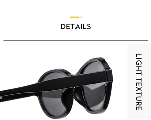 Detail view of wide black sunglasses temples and high-gloss hinge construction