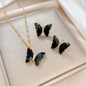 Elegant gold titanium steel butterfly jewelry set with black stones and white zircons