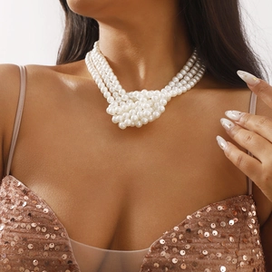 Elegant triple-strand pearl choker necklace with knotted layered design for formal wear