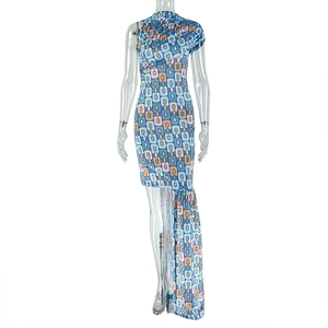 Detail of asymmetric blue geometric print dress with irregular hem and side slit