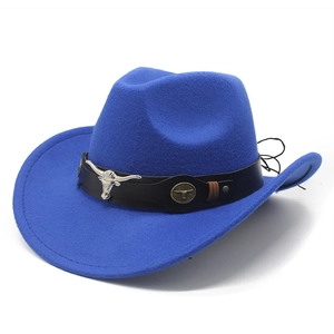 Detail of royal blue wool cowboy hat featuring a black leather band and silver bull emblem