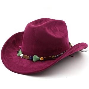 Close-up of wine red suede jazz fedora featuring colorful beaded band and ethnic stones