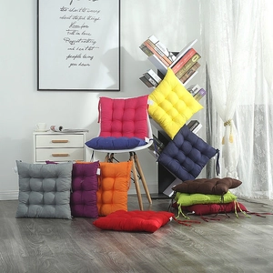 Detail of square chair cushions showing non-slip ties and 9-hole tufted stitching