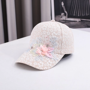 Detail of floral lace baseball cap with 3D chiffon flowers and pearl embroidery