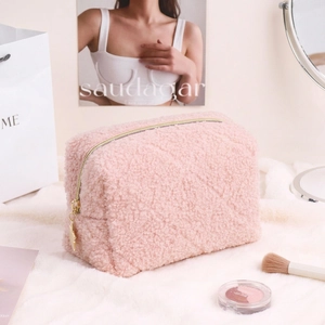 Quilted pink teddy fleece makeup bag with star charm and golden zipper closure