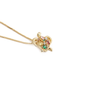Golden box chain necklace with a vibrant sea turtle pendant inlaid with colorful crystals