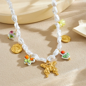 Baroque pearl necklace featuring gold butterfly pendants and colorful ceramic flowers