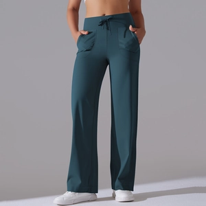 Detailed view of high waisted wide leg yoga pants with drawstring and side pockets