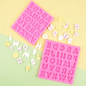 Detail of pink silicone molds with 26 alphabet button textures for fondant and resin crafts