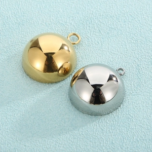Polished gold and silver half-sphere DIY jewelry charms with top rings on blue background