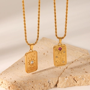 Gold tarot card pendant necklaces with Stella and Lovers relief designs in titanium steel