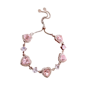 Adjustable rose gold bracelet with pink heart crystals and sparkling white zircons