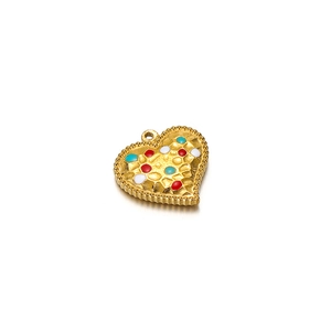 Detail of heart pendant with colorful enamel dots and hammered texture on gold finish