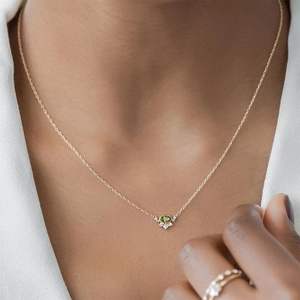 S925 sterling silver necklace with oval olive green zircon pendant worn by model