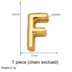 Detailed view of golden letter F pendant dimensions in copper with 13mm by 7mm size