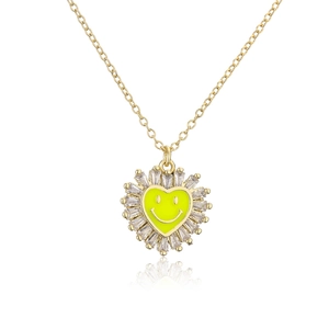 Detailed view of heart pendant necklace with yellow smiley face and zircon crystals