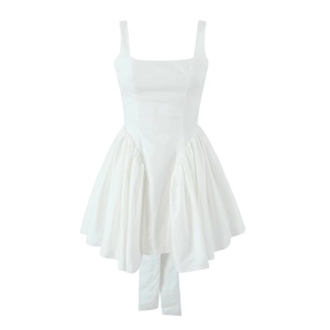 Detail of white square neck mini dress featuring a bow tie back and flared puff hemline