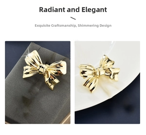 Detailed close-up of a glossy gold bow brooch with a polished metallic finish and elegant design