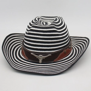 Western straw cowboy hat with black and white stripes and silver longhorn bull emblem