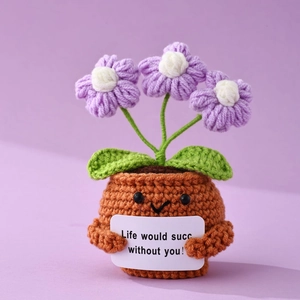 Detail of crochet potted plant with purple flowers and motivational quote card