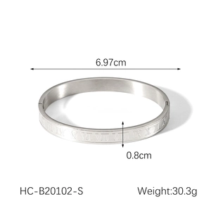 Detailed view of silver roman numeral bangle with 0.8cm width and 6.97cm diameter dimensions