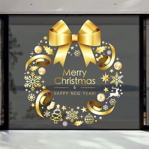 Golden Christmas wreath window decal featuring snowflakes, reindeer and holiday greetings