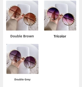 Detail of round sunglasses featuring pearl embellishments and gradient tinted lenses