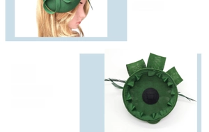 Detail view of green fascinator hat with feathers and internal clip for elegant hair styling
