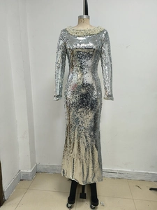 Close-up of the silver sequin evening gown featuring a pearl-embellished round neckline