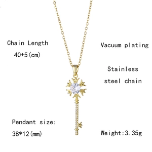 Detail showing 18K gold plated stainless steel heart key pendant with zircon insets