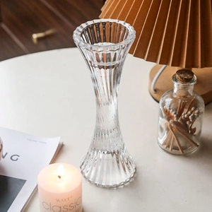 Nordic ribbed glass candle holder with a clear hourglass silhouette and vintage texture