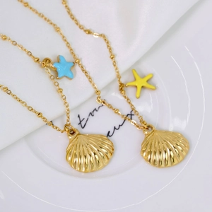 14K gold plated stainless steel necklace with seashell pendant and blue starfish charms