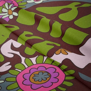 Macro detail of retro floral tapestry showing soft fabric texture and hippie flower pattern