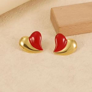 Chic 18K gold plated stainless steel heart earrings with red enamel on a warm background