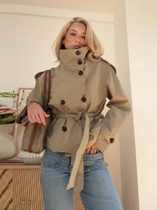 Short double-breasted trench coat with waist belt and high collar in elegant beige
