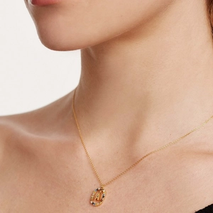 Gold letter A necklace with colorful crystals on a stylish oval pendant for women