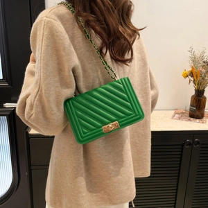 Chic green quilted crossbody bag with golden chain and square clasp for women