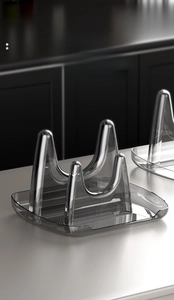 Close-up of minimalist grey transparent lid holder with U-shaped slot and drip tray