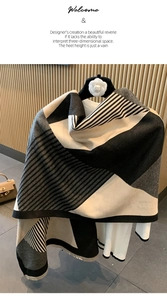 Detail of soft winter shawl showing black and grey geometric patterns and thick texture