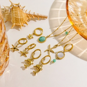 14K gold plated titanium necklace and earrings set with sea star and dolphin charms