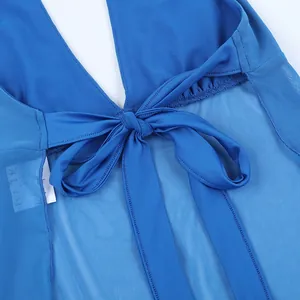 Detail of royal blue halter top featuring semi-transparent mesh and a bow tie-up closure