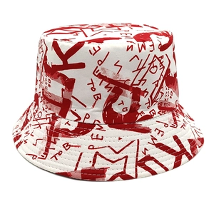 Close-up of red graffiti print on white canvas bucket hat with reinforced stitching