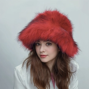 Detail of oversized bright red faux fur fluffy hat featuring a long plush punk style texture