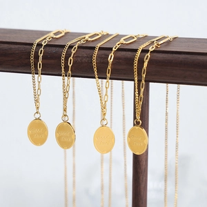 Gold plated stainless steel double layered necklace with engraved Good Luck pendant