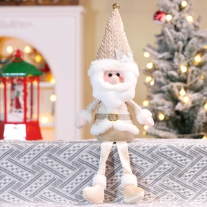 Close-up of champagne gold Christmas gnome with long legs on a festive background